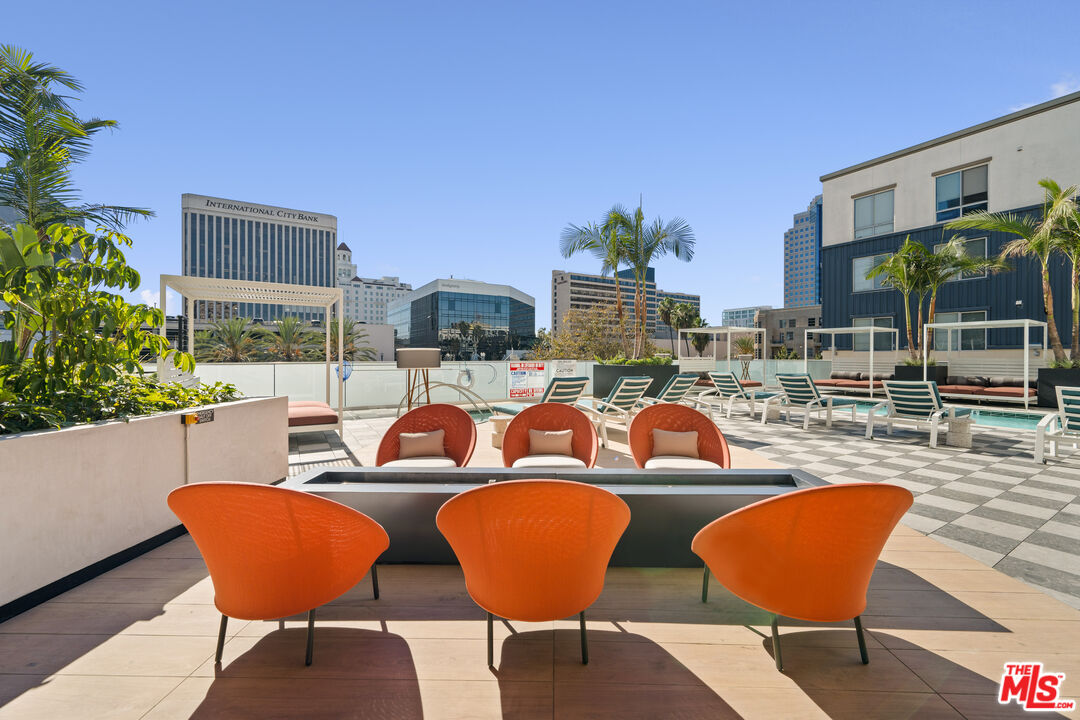 250 East Broadway, Unit 803 Long Beach, CA 90802 - Photo 21 of 44 a view of a chairs and table in the patio