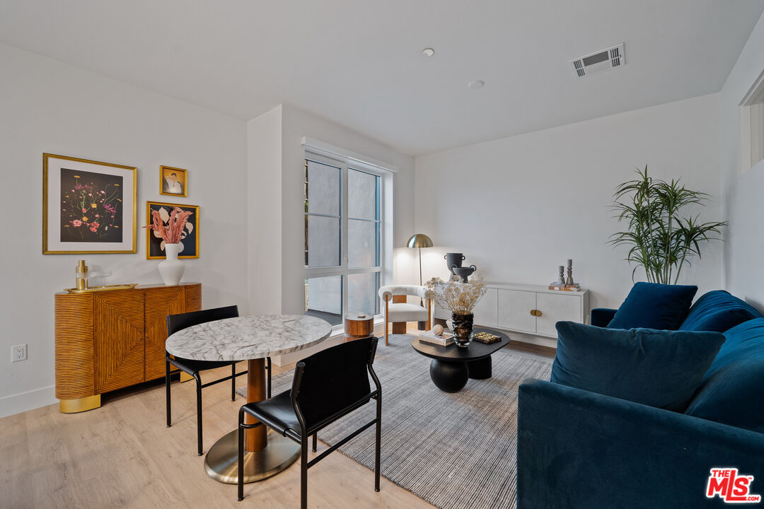 250 East Broadway, Unit 803 Long Beach, CA 90802 - Photo 33 of 44 a living room with furniture and a potted plant