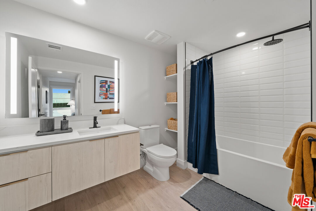 250 East Broadway, Unit 803 Long Beach, CA 90802 - Photo 39 of 44 a bathroom with a double vanity sink toilet and shower