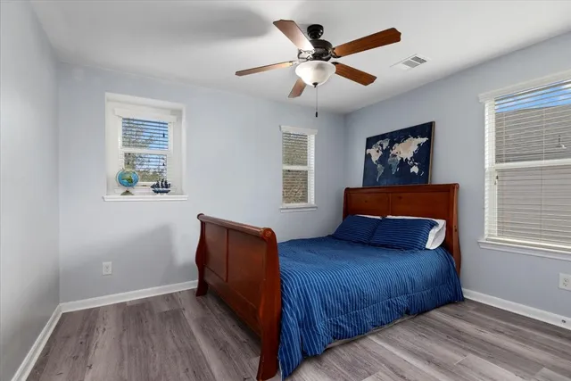 a bedroom with a large bed window and a window