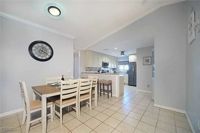 a view of a dining room with furniture and a clock