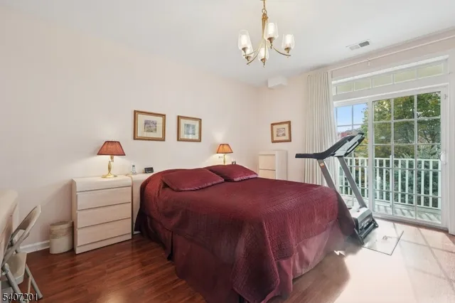 a spacious bathroom with a tub sink and mirror