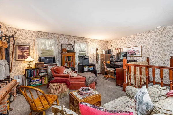 a bedroom with a bed and dresser