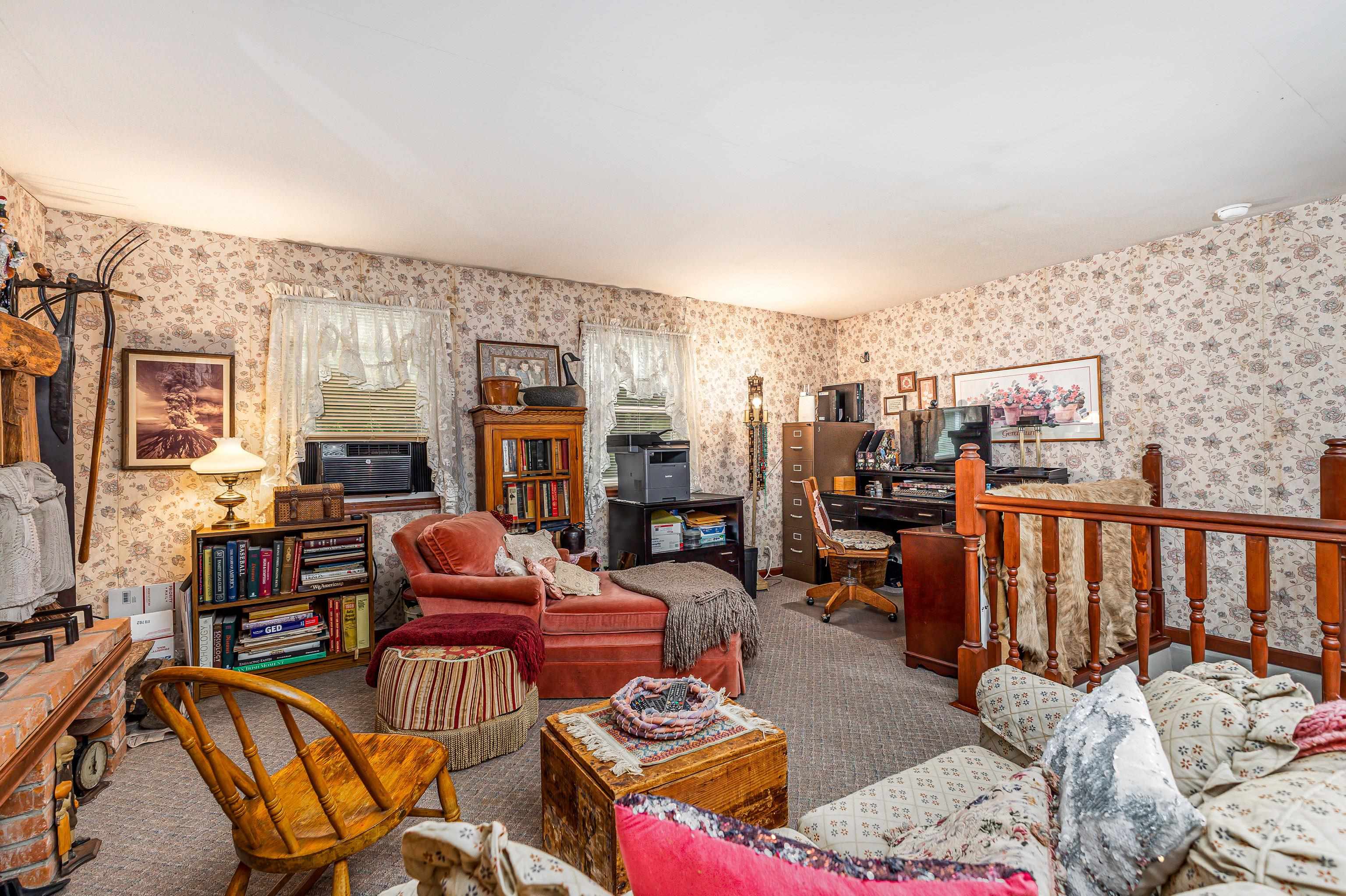 103 4th Street Galena, IL 61036 - Photo 18 of 64 a living room with furniture a rug and a fireplace