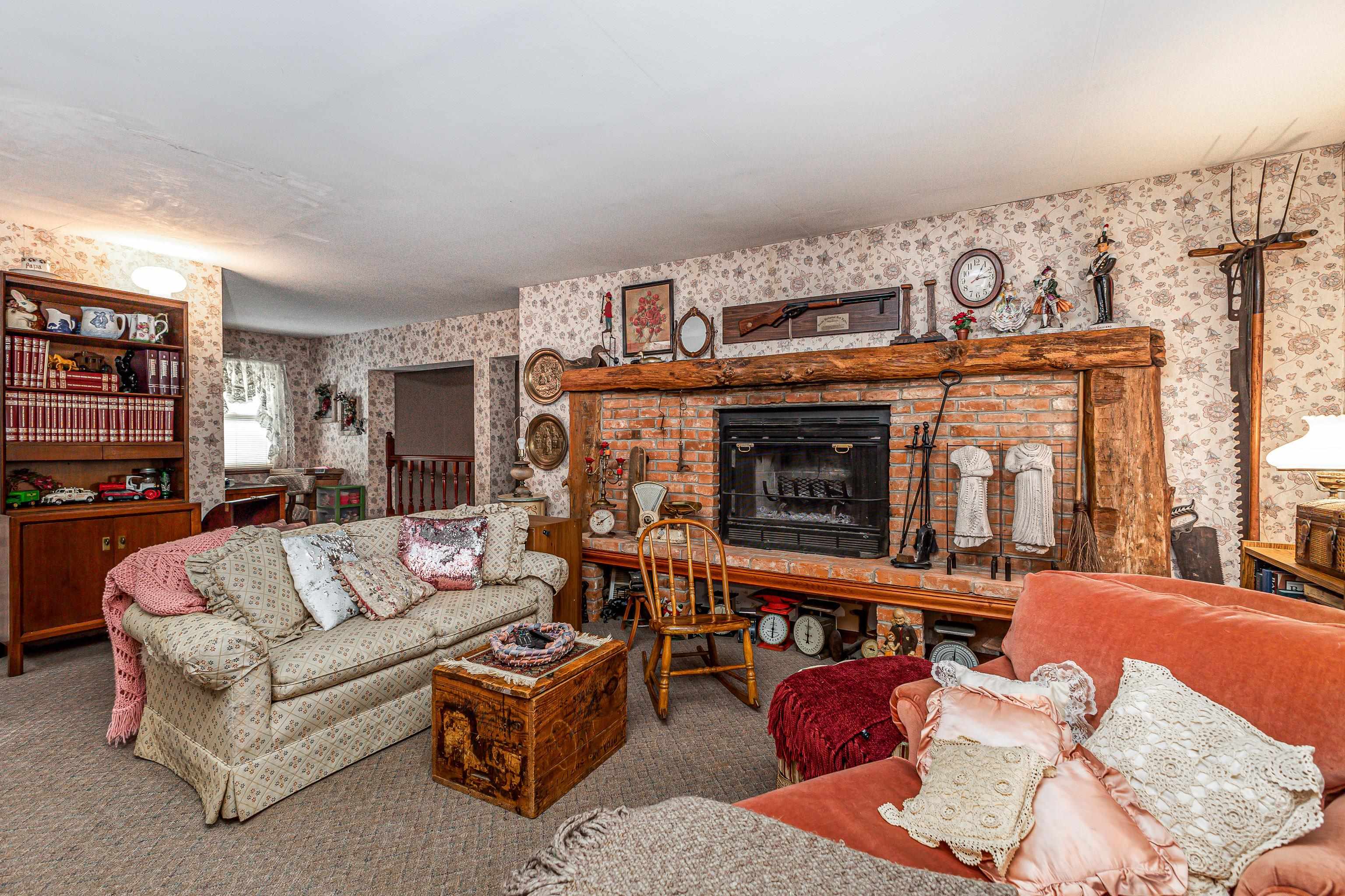 103 4th Street Galena, IL 61036 - Photo 19 of 64 a living room with furniture a fireplace and a flat screen tv