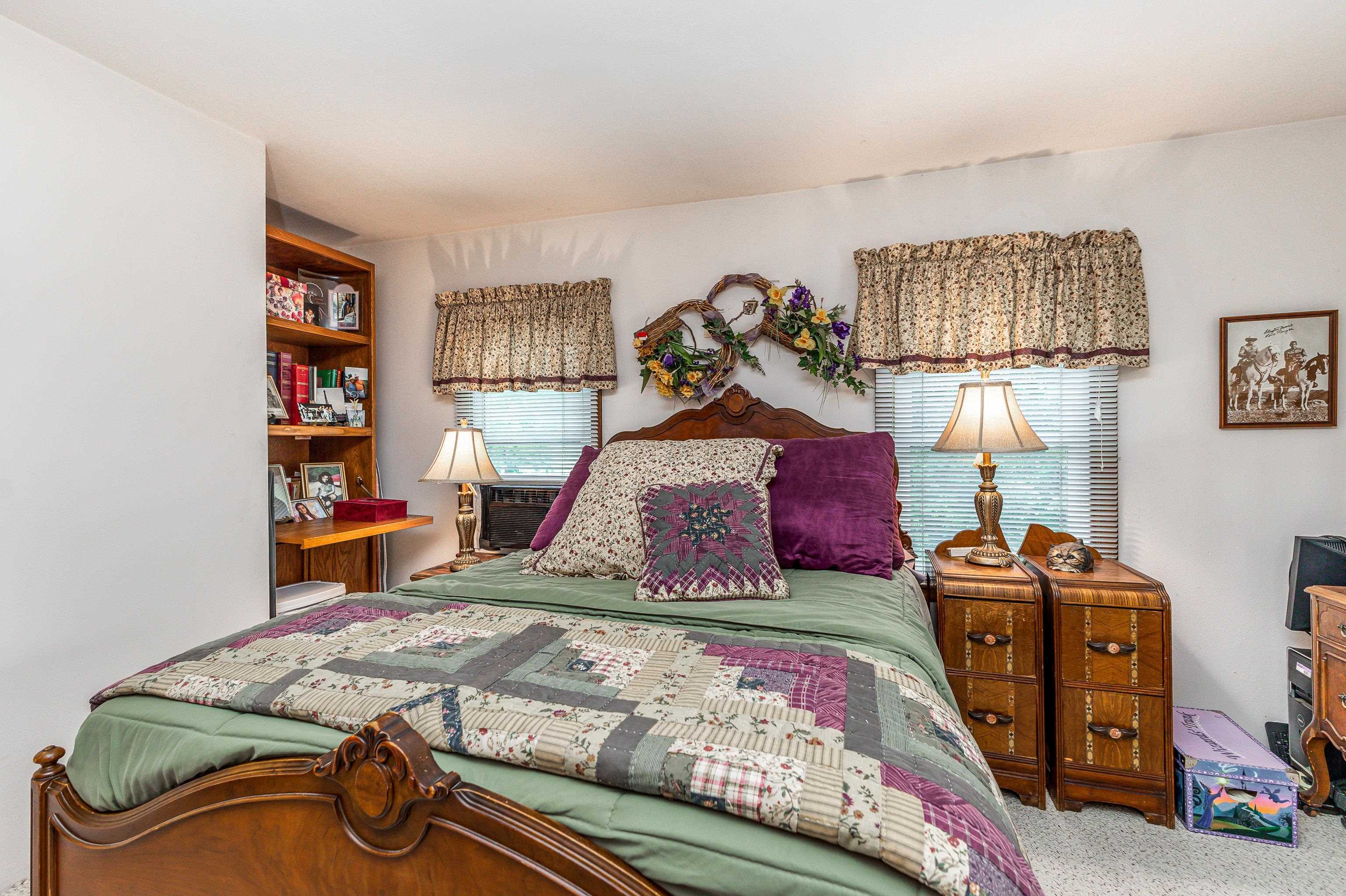 103 4th Street Galena, IL 61036 - Photo 22 of 64 a bedroom with a bed and dresser