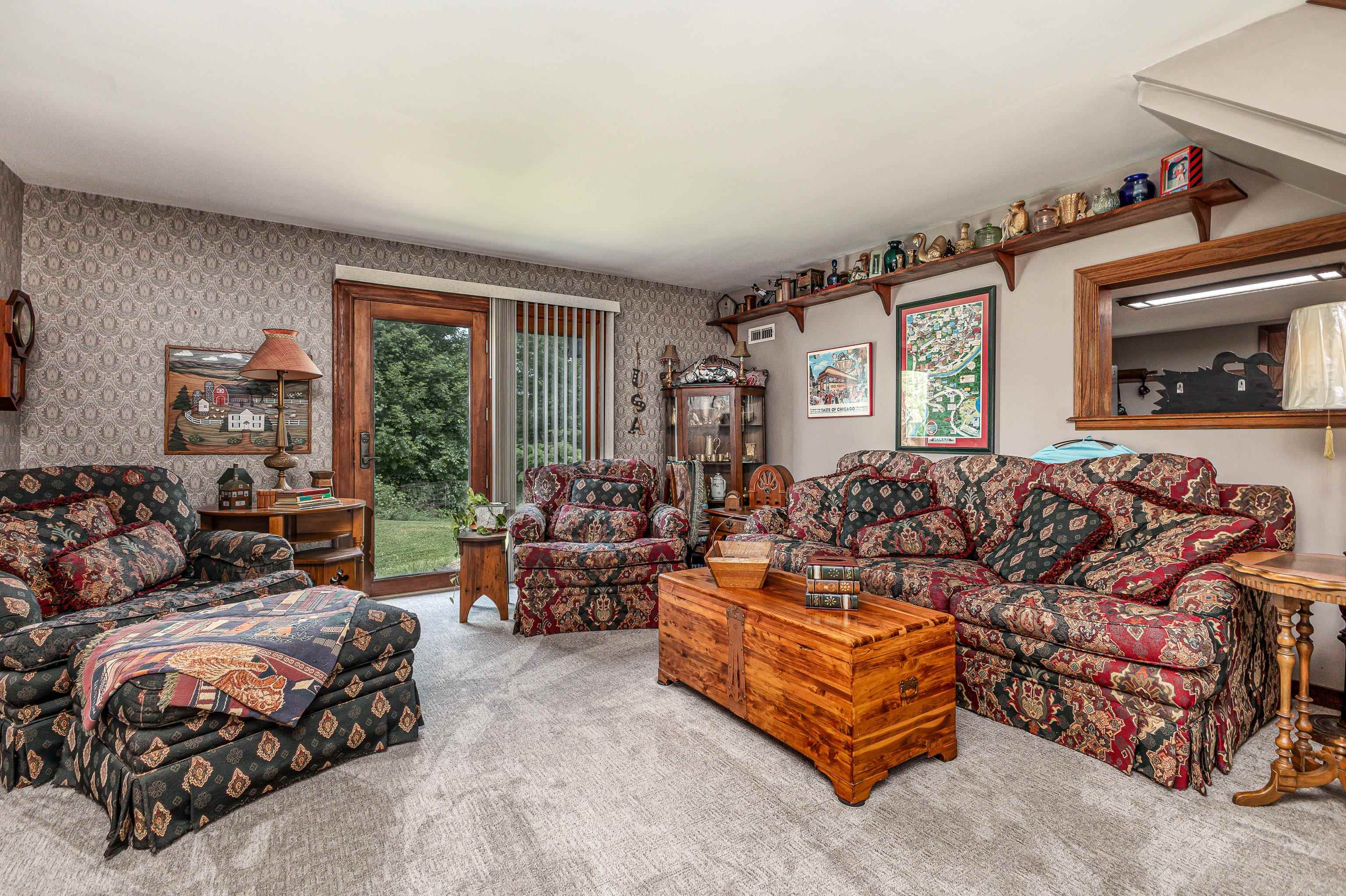 103 4th Street Galena, IL 61036 - Photo 26 of 64 a spacious bedroom with a bed a couch and a window