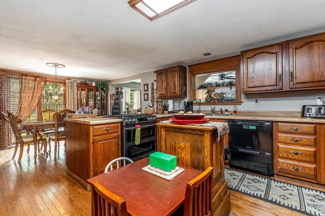 a view of a patio with a table and chairs