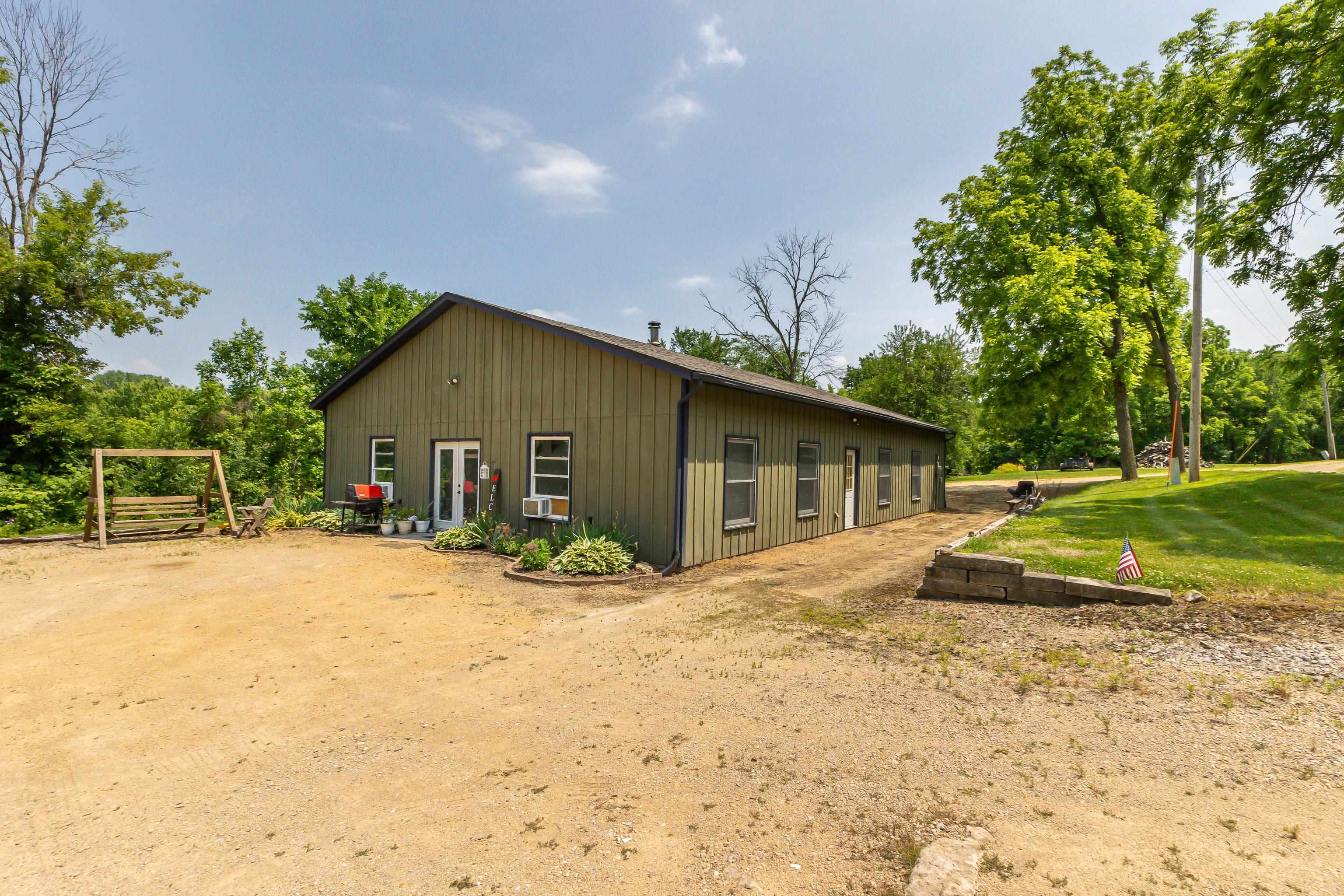 103 4th Street Galena, IL 61036 - Photo 46 of 64 a front view of house with yard and trees around