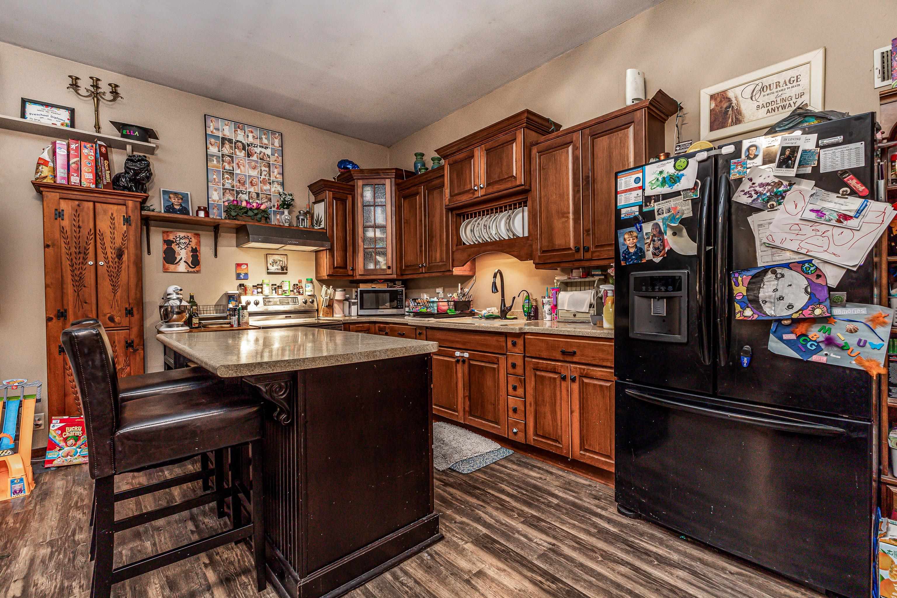 103 4th Street Galena, IL 61036 - Photo 48 of 64 a kitchen with stainless steel appliances granite countertop a refrigerator and a stove top oven