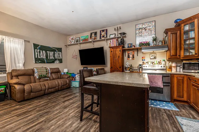 an aerial view of a house with swimming pool and garden