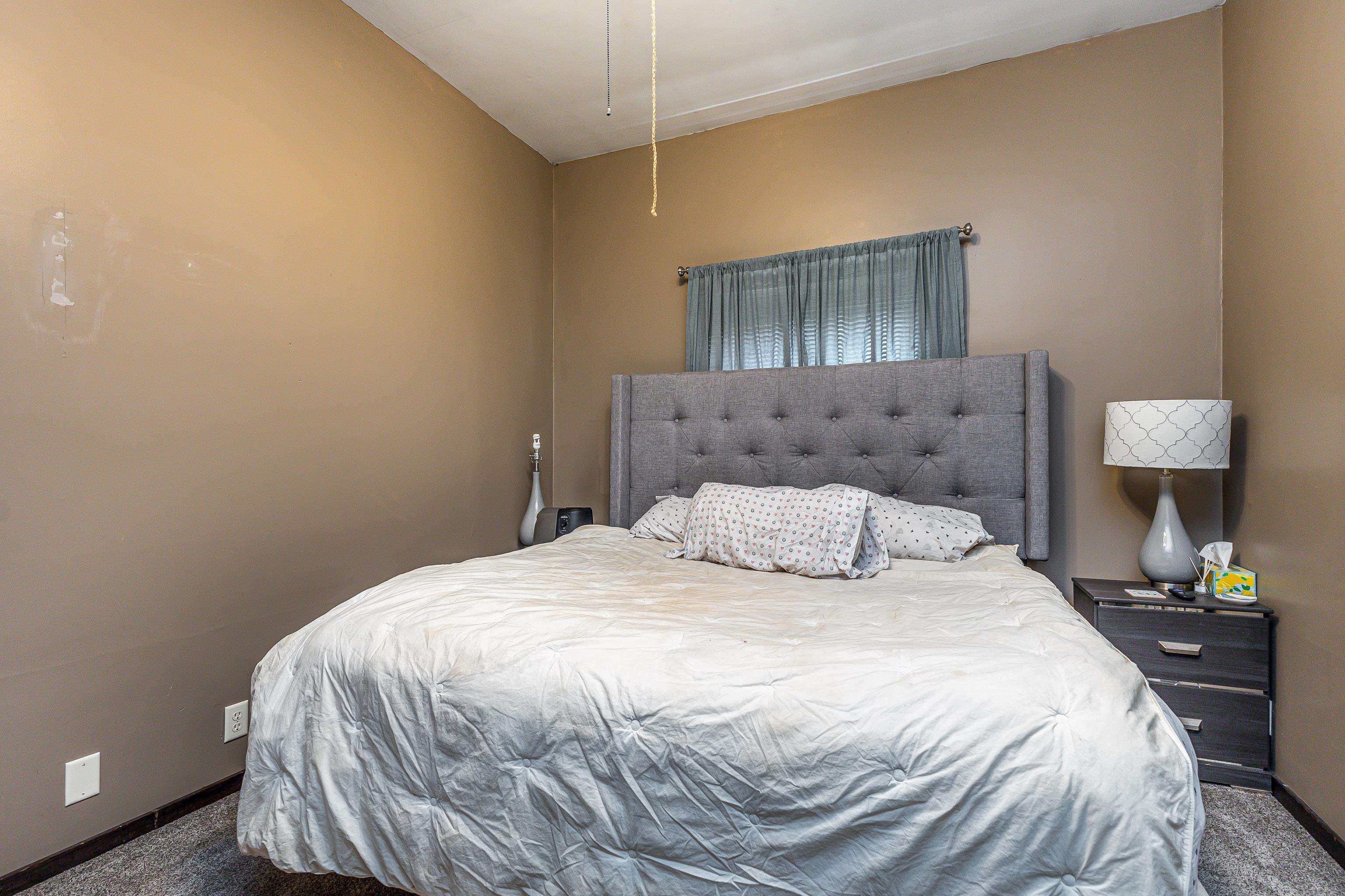 103 4th Street Galena, IL 61036 - Photo 52 of 64 a bedroom with a bed and a lamp