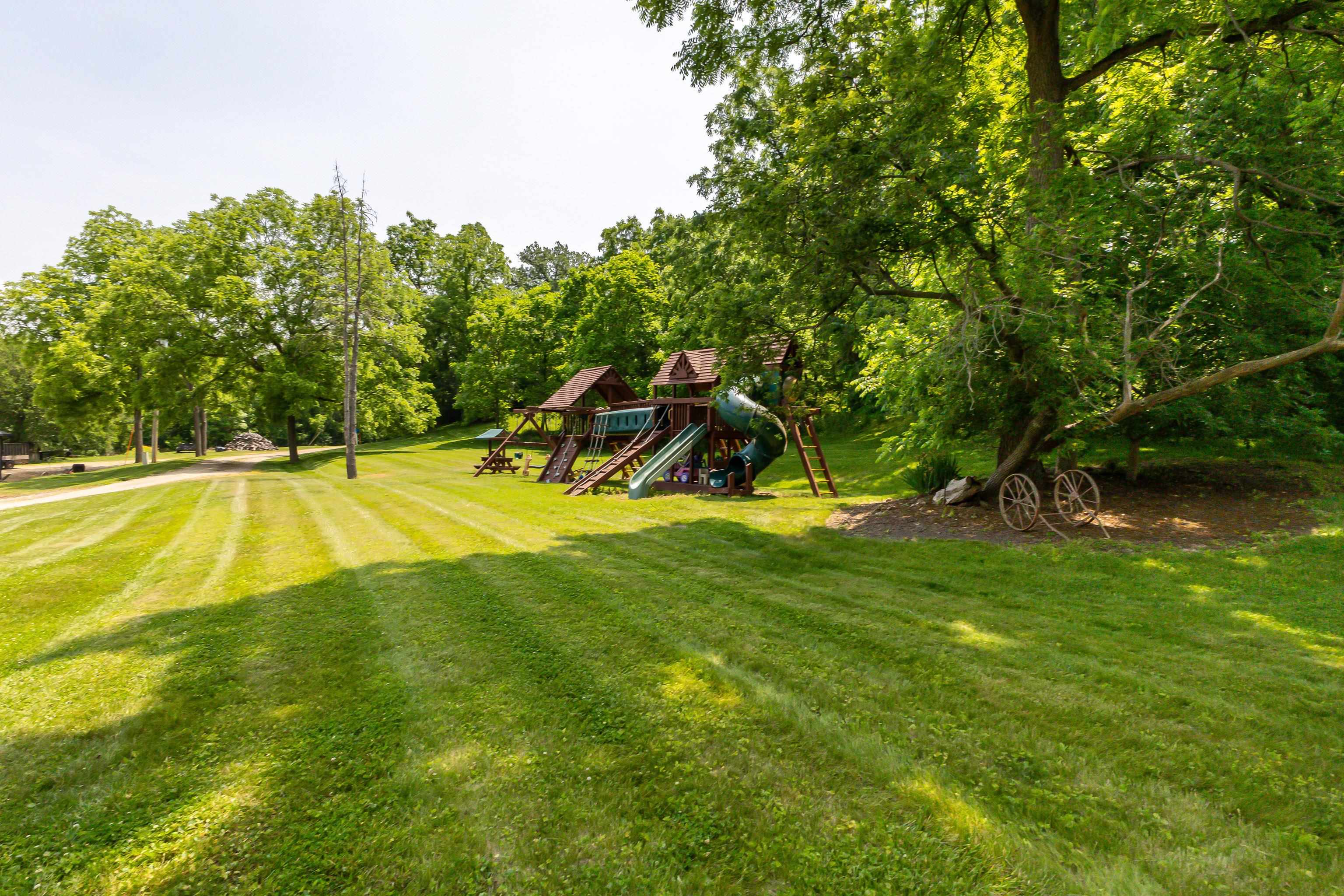 103 4th Street Galena, IL 61036 - Photo 56 of 64 a view of swimming pool with a yard and large trees