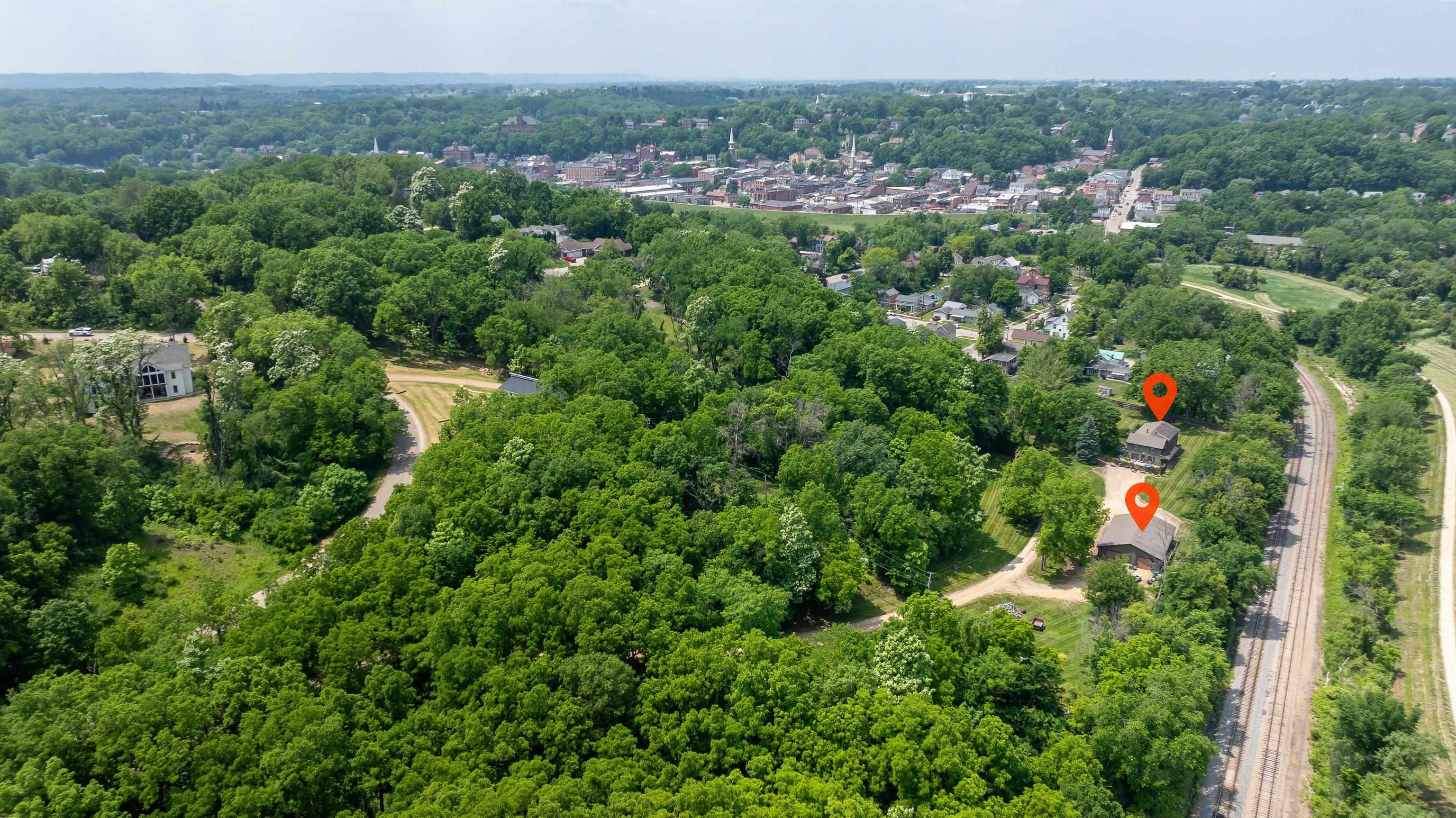 103 4th Street Galena, IL 61036 - Photo 59 of 64 an aerial view of residential house with outdoor space and trees all around