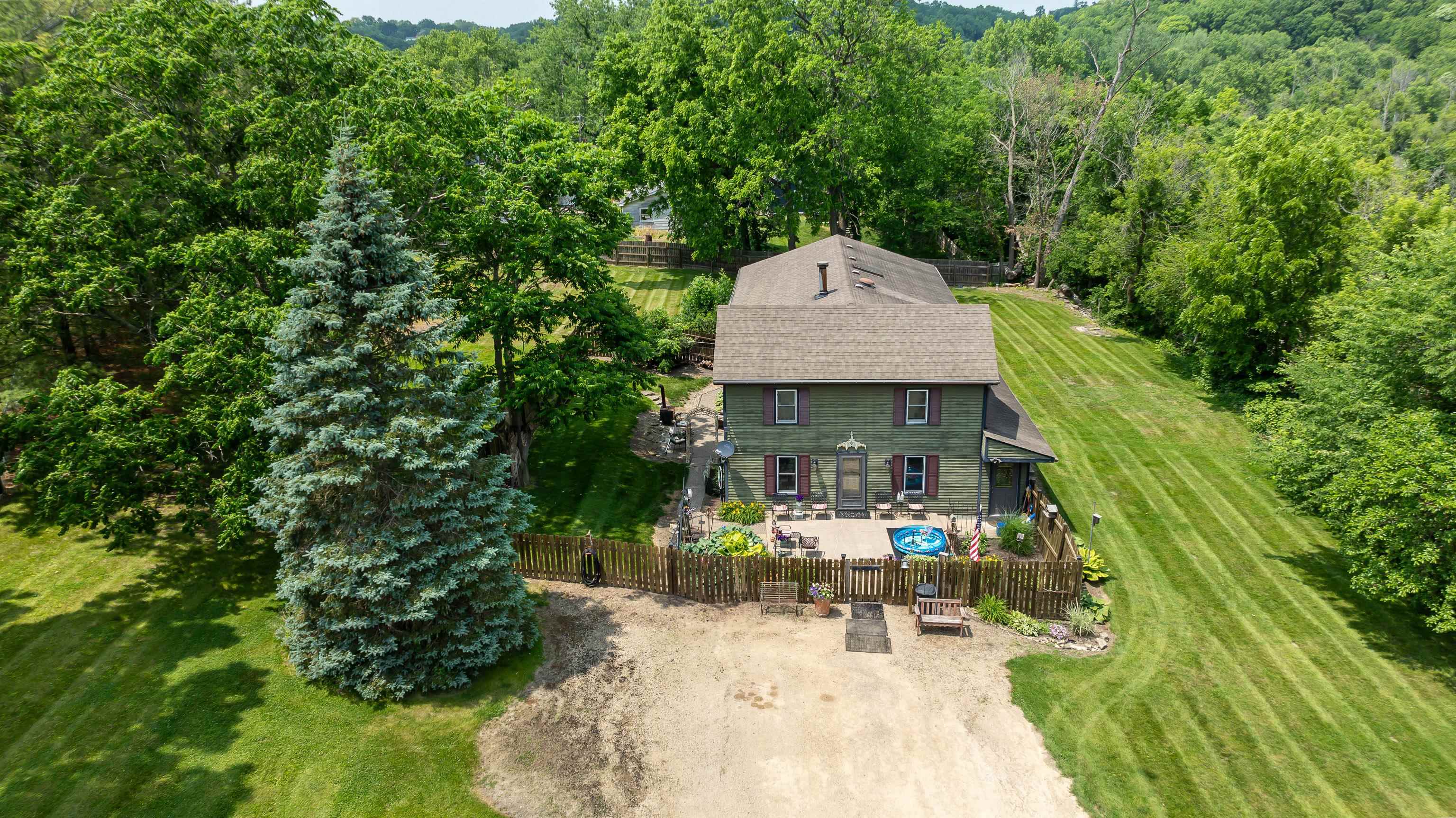 103 4th Street Galena, IL 61036 - Photo 63 of 64 an aerial view of a house with swimming pool and garden
