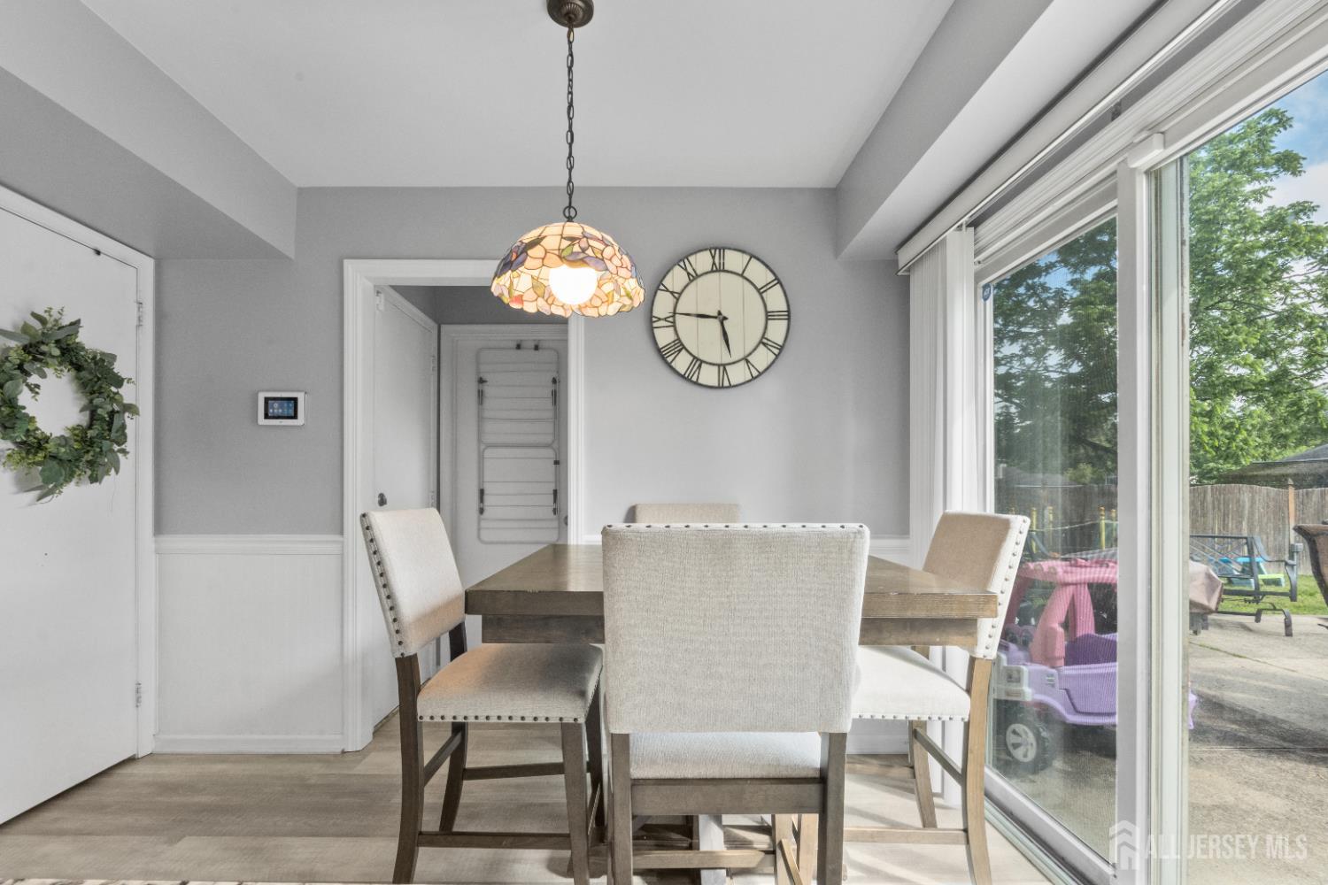 3 Mendon Drive Howell, NJ 07731 - Photo 12 of 23 a dining room with furniture a chandelier and wooden floor