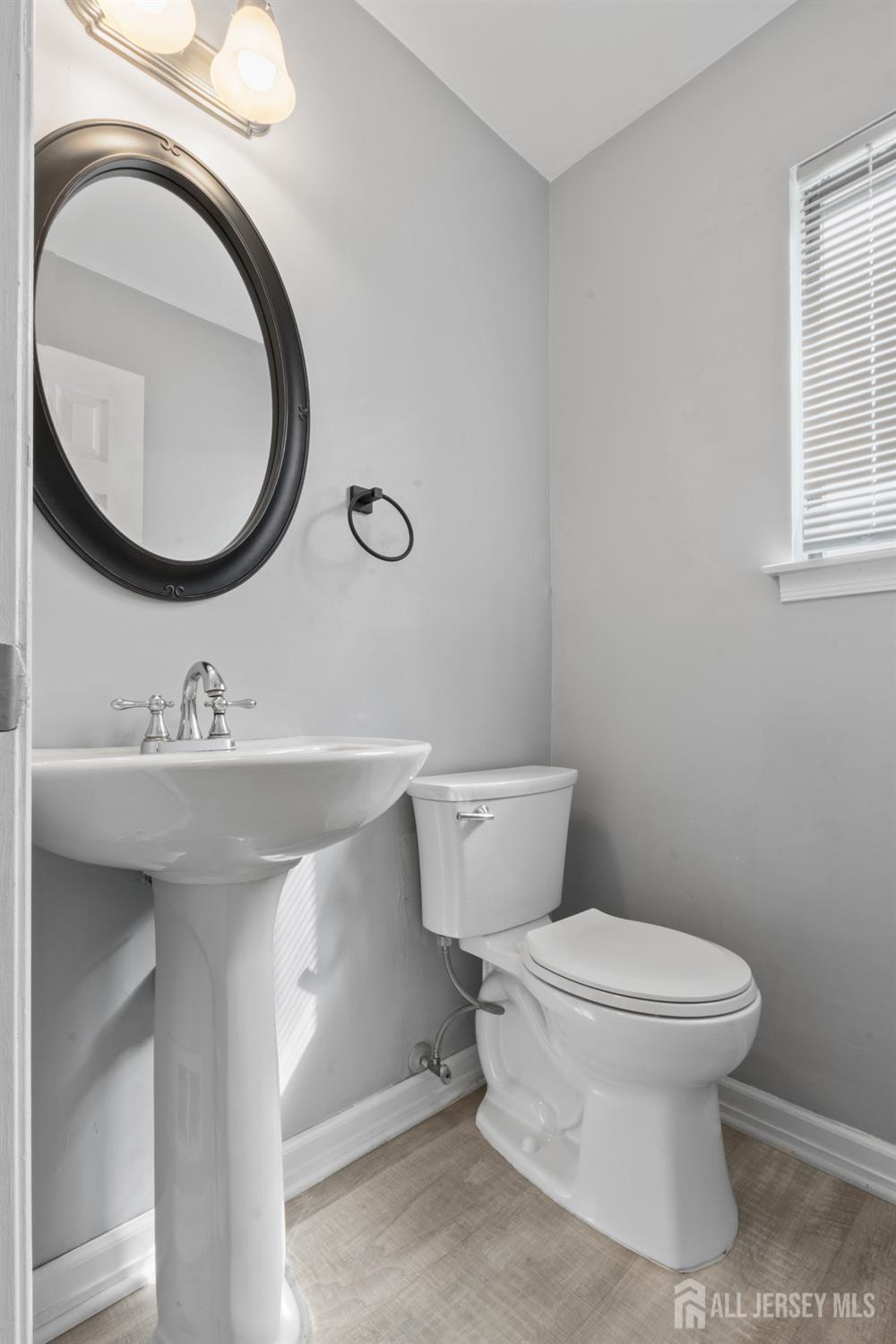 3 Mendon Drive Howell, NJ 07731 - Photo 13 of 23 a bathroom with a toilet sink and mirror
