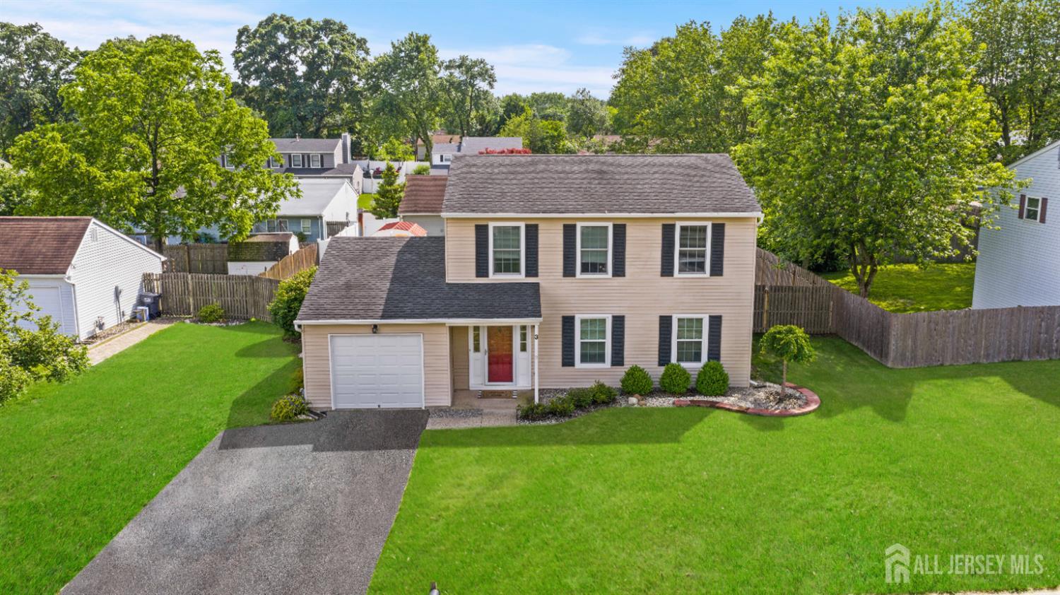 3 Mendon Drive Howell, NJ 07731 - Photo 2 of 23 a front view of a house with a yard and trees