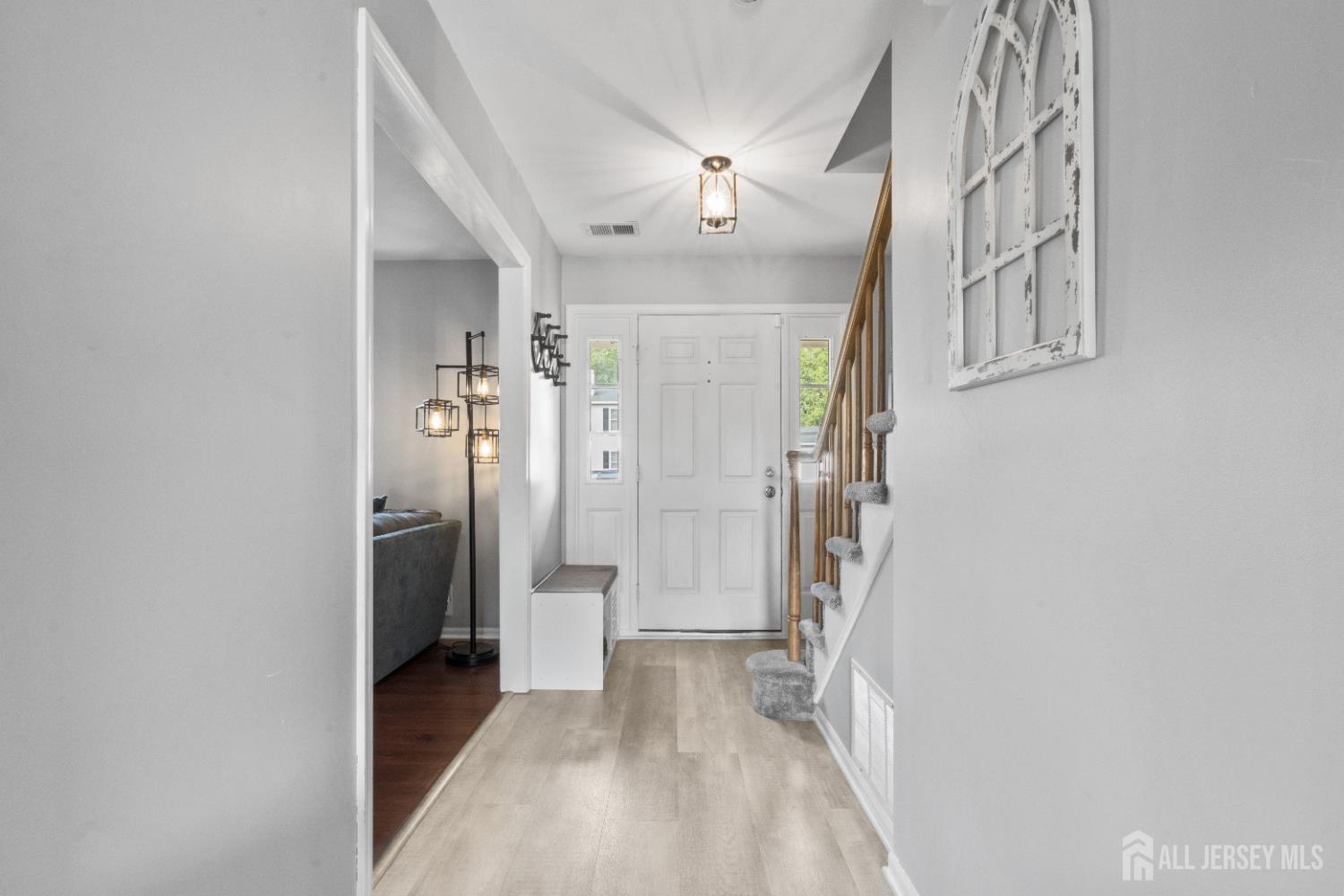 3 Mendon Drive Howell, NJ 07731 - Photo 3 of 23 a view of livingroom with hardwood floor and a ceiling fan