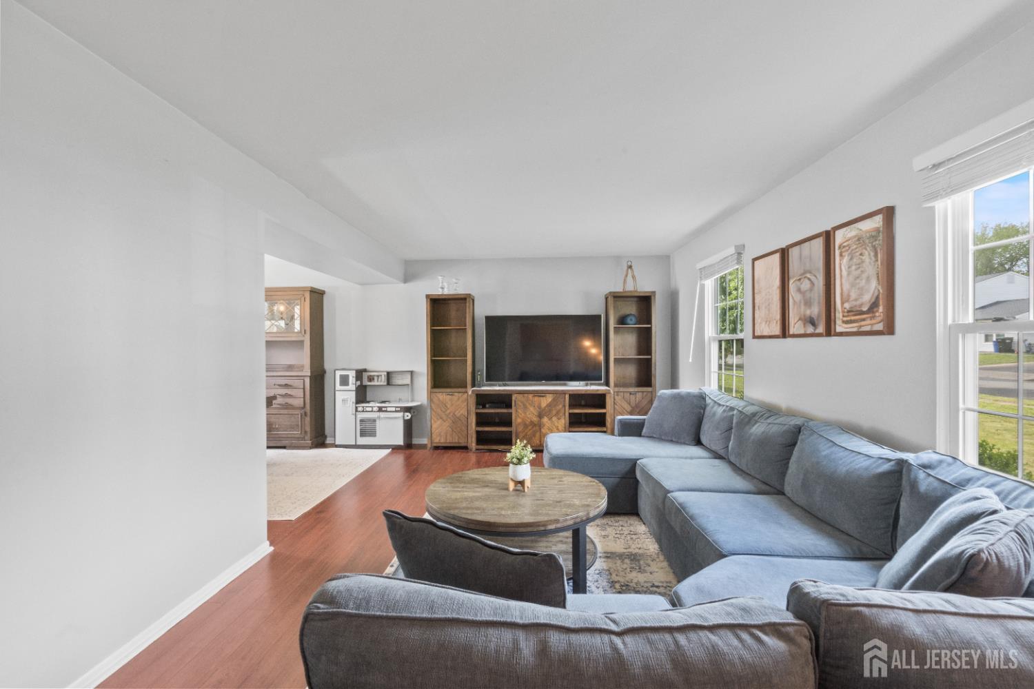 3 Mendon Drive Howell, NJ 07731 - Photo 4 of 23 a living room with furniture and a flat screen tv