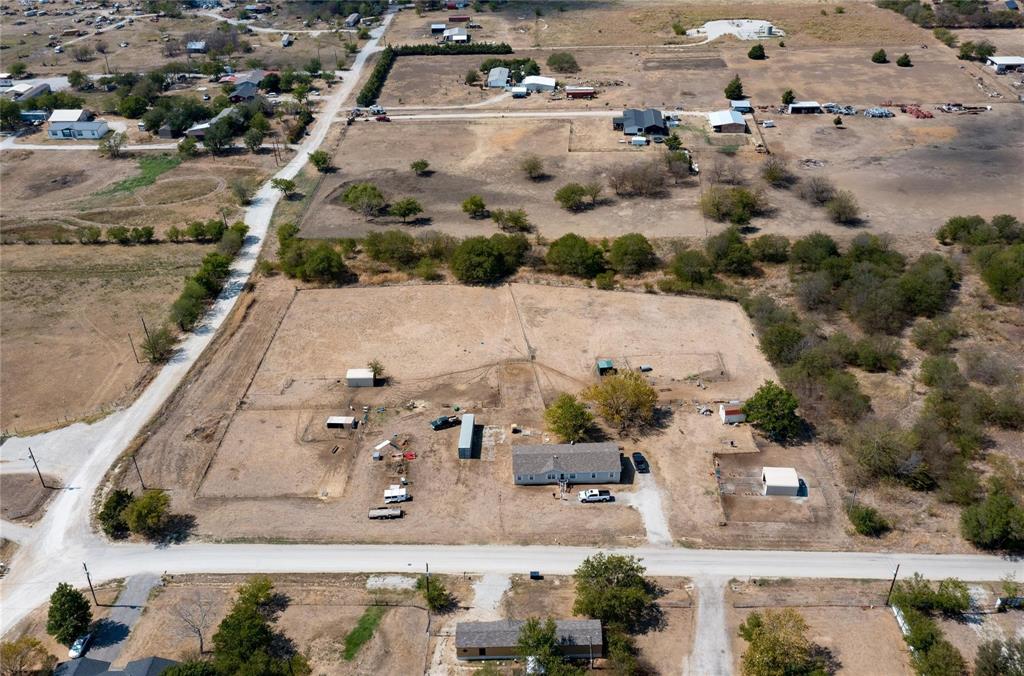 4260 Couch Road Ponder, TX 76259 - Photo 24 of 25 an aerial view of multiple houses with outdoor space