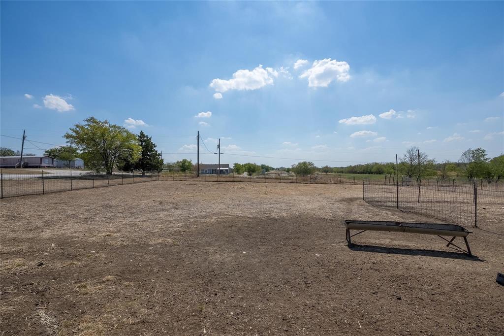 4260 Couch Road Ponder, TX 76259 - Photo 9 of 25 View of yard featuring a view of countryside