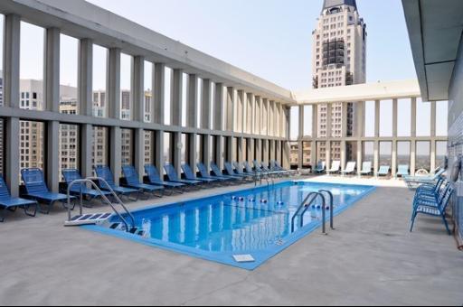 100 East Walton Street, Unit 27B Chicago, IL 60611 - Photo 15 of 18 a view of a chairs and table in a balcony
