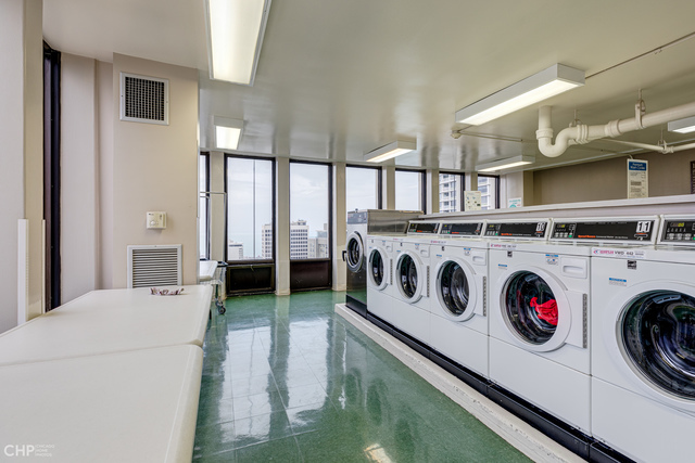 100 East Walton Street, Unit 27B Chicago, IL 60611 - Photo 17 of 18 a utility room with dryer and washer
