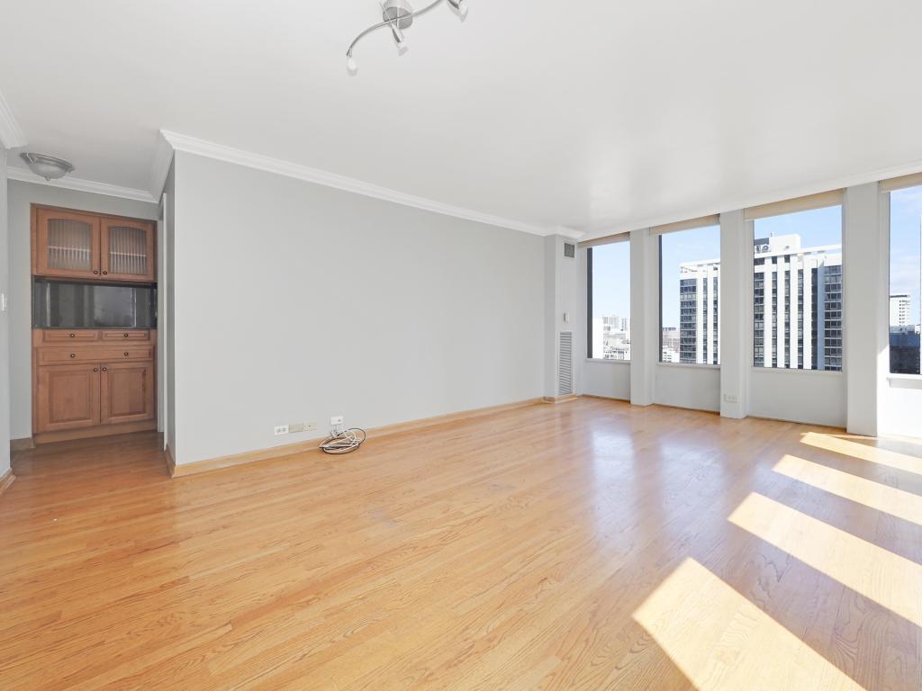 100 East Walton Street, Unit 27B Chicago, IL 60611 - Photo 3 of 18 wooden floor in an empty room