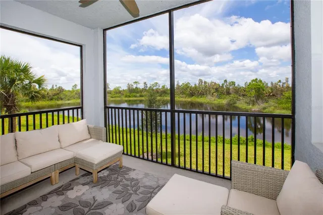a balcony with furniture and city view