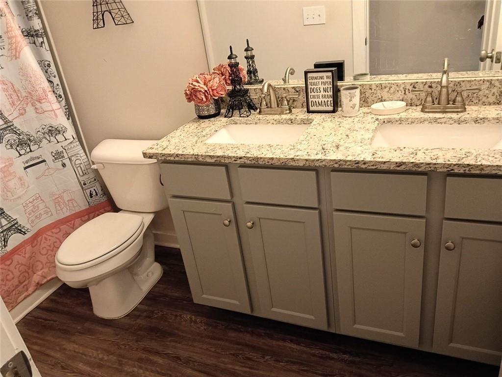 807 Ridgeview Court Hampton, GA 30228 - Photo 53 of 69 a bathroom with a granite countertop toilet sink and mirror