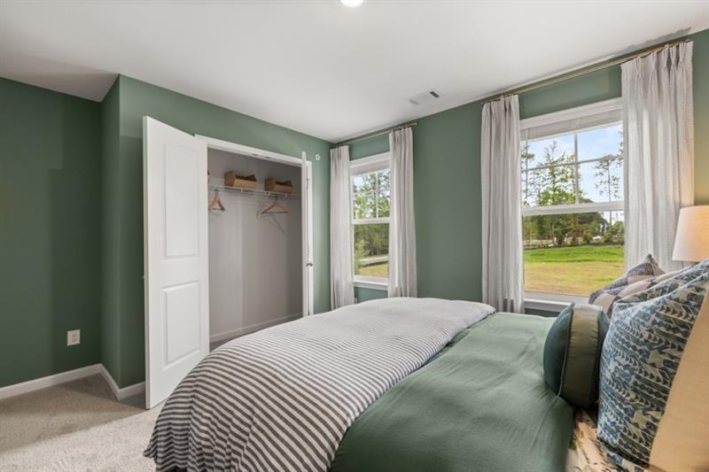 422 Red Dragon Drive Jefferson, GA 30549 - Photo 18 of 20 a bedroom with a bed and a large window