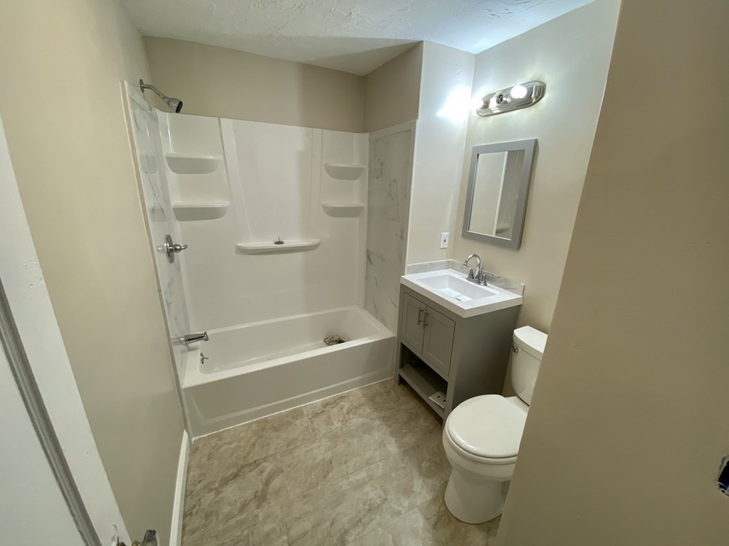 181 Center Road Shirley, MA 01464 - Photo 8 of 11 a bathroom with a sink a toilet and shower