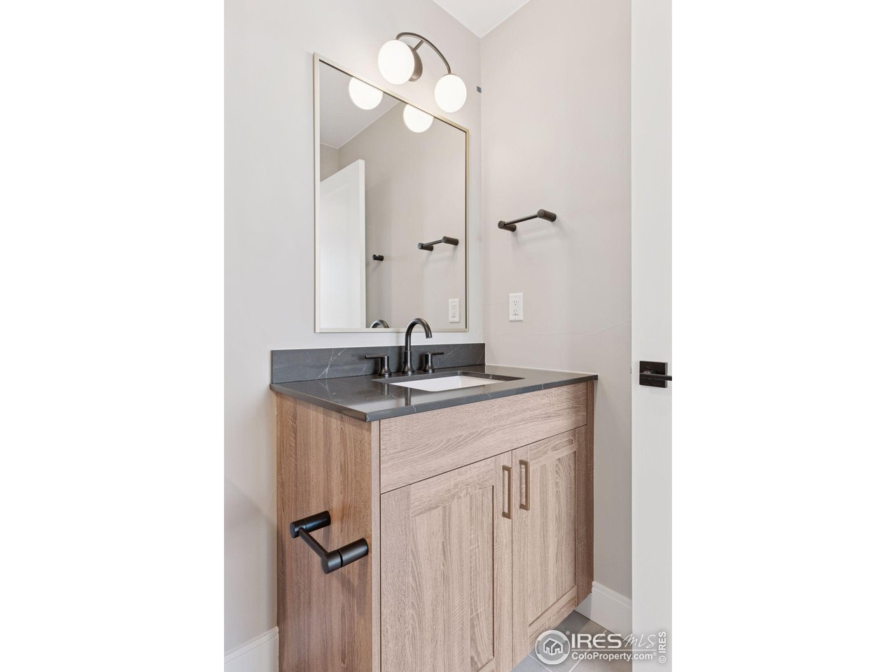927 William Way Berthoud, CO 80513 - Photo 18 of 28 a bathroom with a sink and a mirror