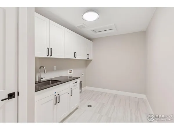 a kitchen with cabinets and window