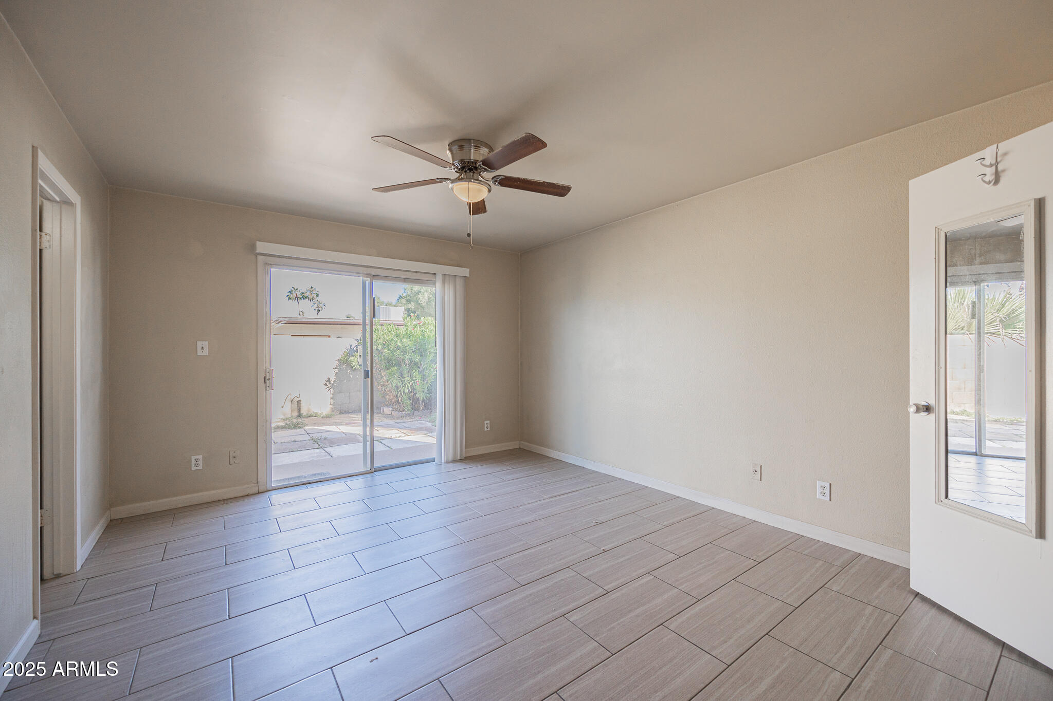2724 South Azalea Drive Tempe, AZ 85282 - Photo 12 of 25 a view of an empty room with a window