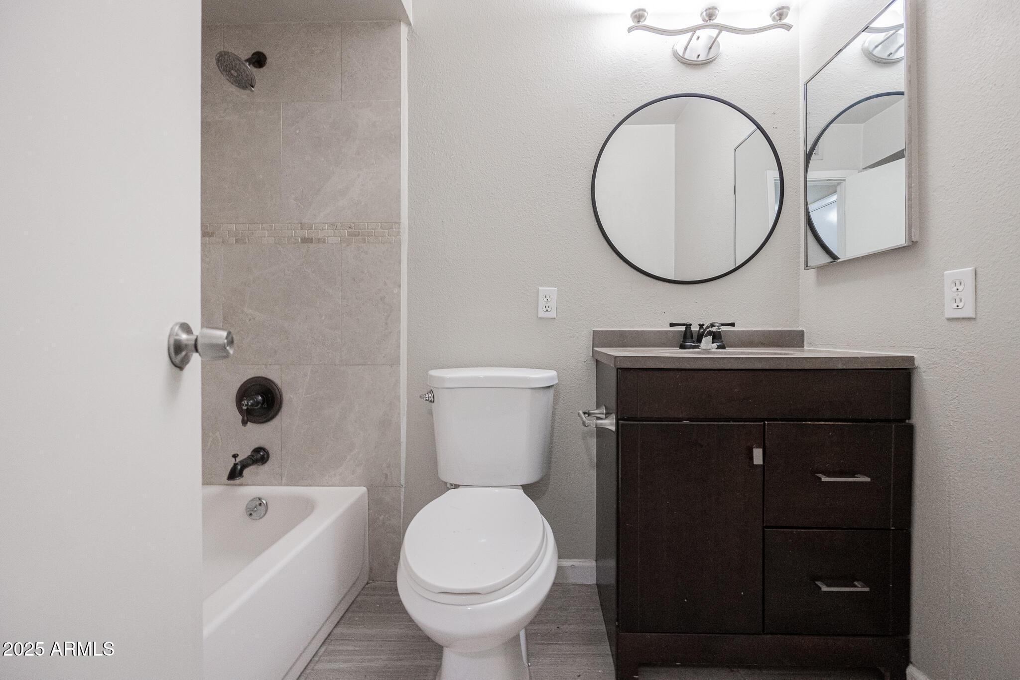 2724 South Azalea Drive Tempe, AZ 85282 - Photo 17 of 25 a bathroom with a sink a toilet and a mirror