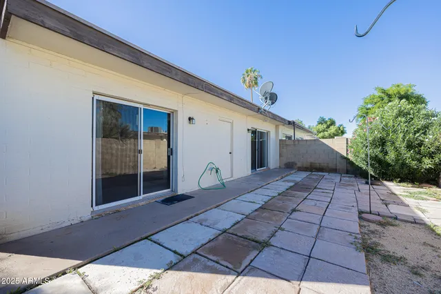 a view of backyard with seating space