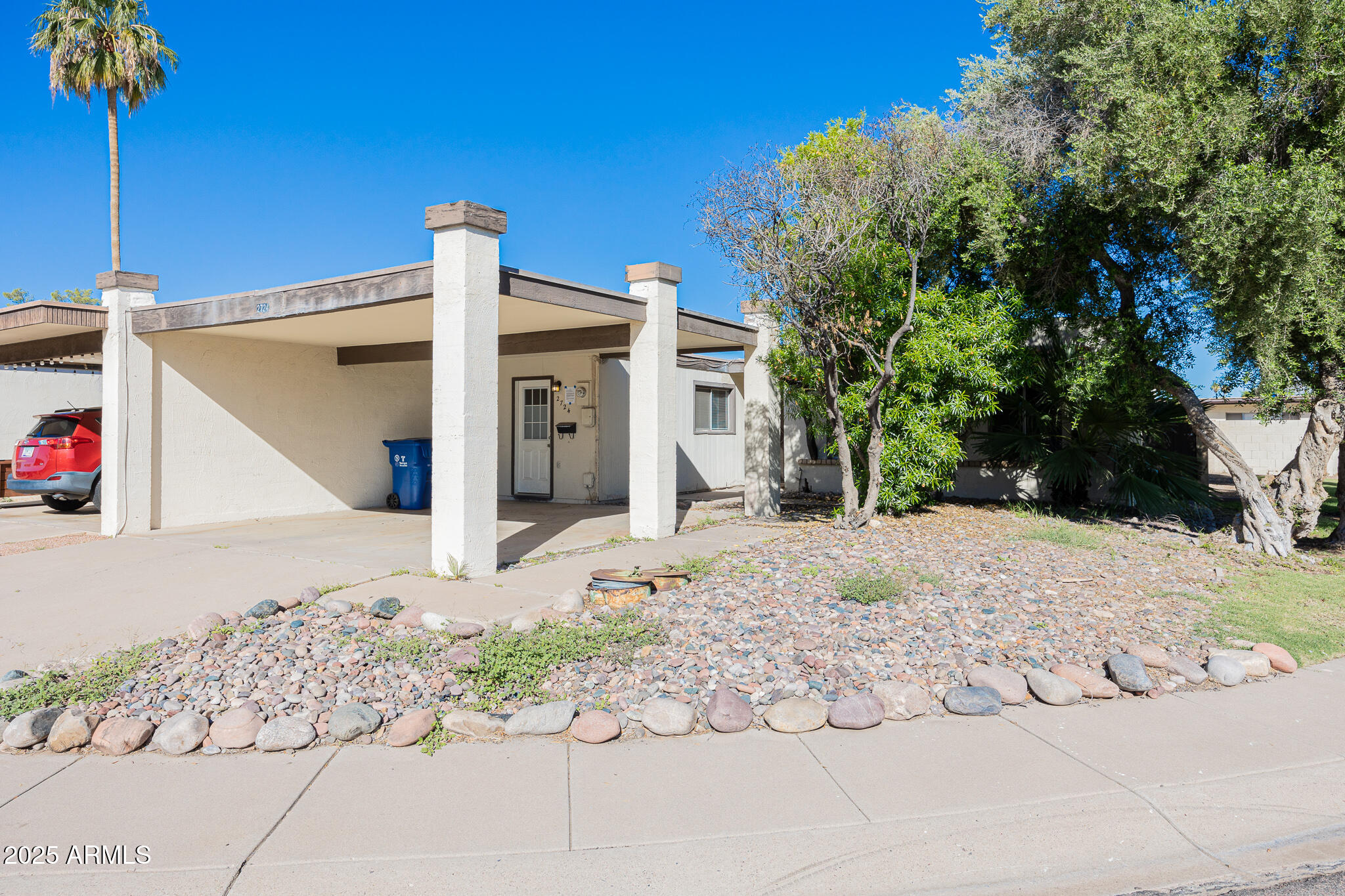 2724 South Azalea Drive Tempe, AZ 85282 - Photo 3 of 25 a view of a two house with snow on the road