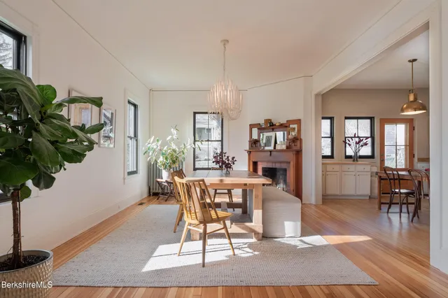 a living room with furniture a window and a chandelier
