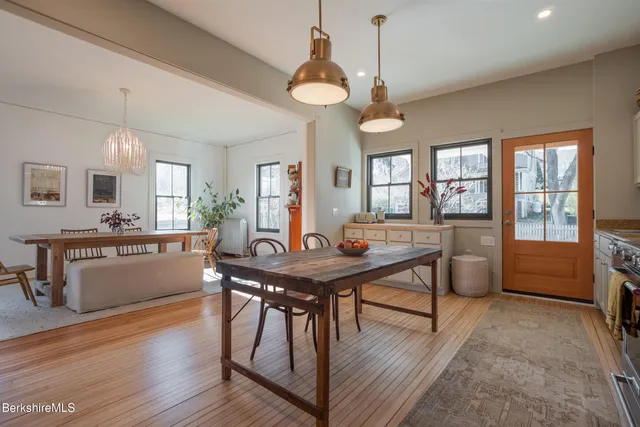 a living room with furniture window and wooden floor
