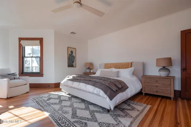 a bedroom with a bed and a dresser in it