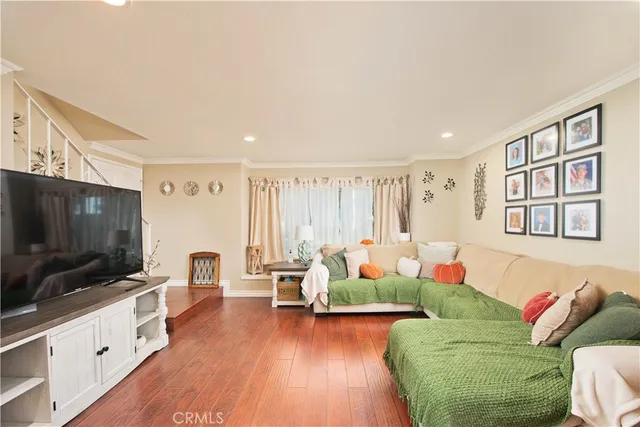 a bedroom with furniture and a large window