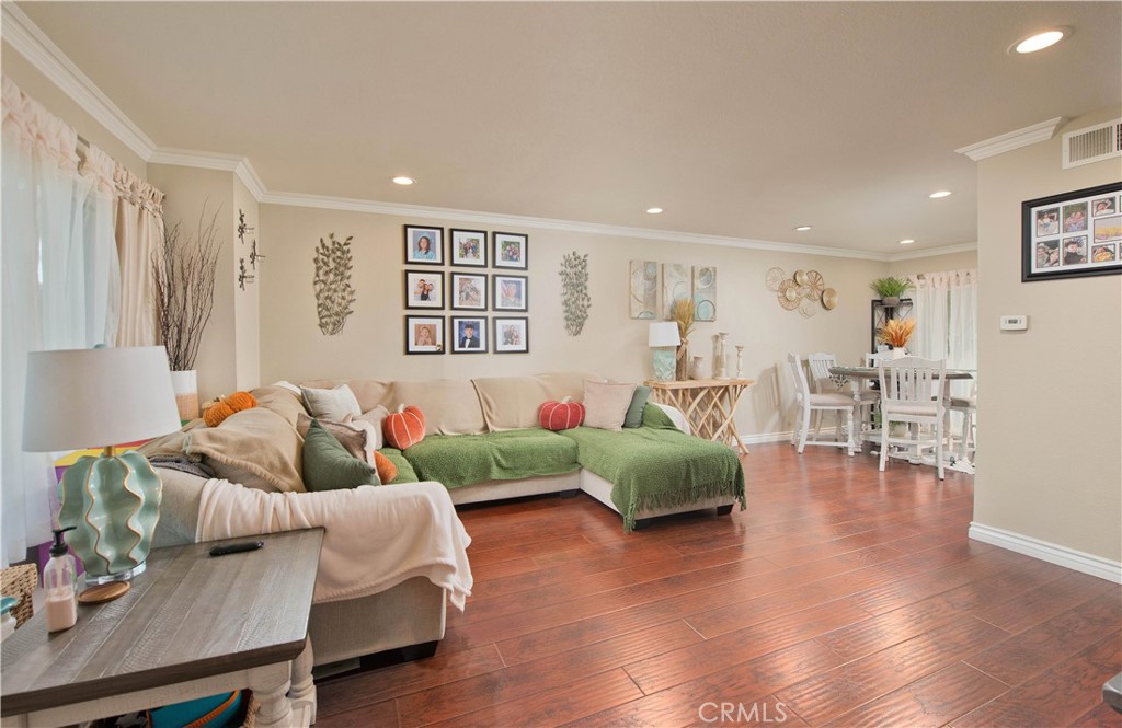 1124 Okapi Lane Ventura, CA 93003 - Photo 15 of 22 a living room with furniture and a wooden floor