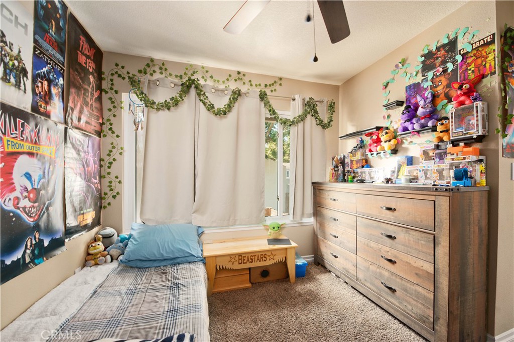 1124 Okapi Lane Ventura, CA 93003 - Photo 20 of 22 a bedroom with a bed and a dresser