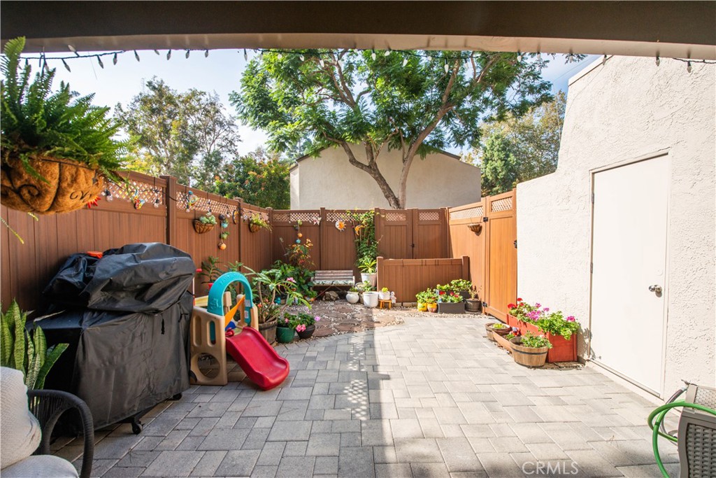 1124 Okapi Lane Ventura, CA 93003 - Photo 4 of 22 a view of a chairs and table in backyard