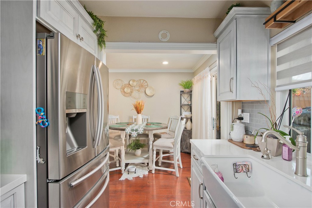 1124 Okapi Lane Ventura, CA 93003 - Photo 8 of 22 a kitchen with stainless steel appliances granite countertop a refrigerator and a stove top oven