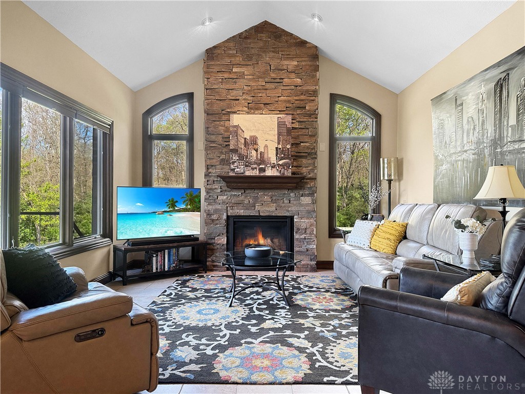 4096 Middle Urbana Road Urbana, OH 43078 - Photo 82 of 96 This family room features a fireplace and offers serene views of nature.