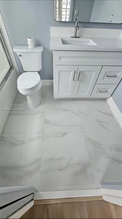 a bathroom with a toilet and a sink
