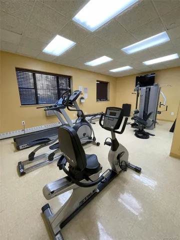 a view of a dining room with furniture and a chandelier
